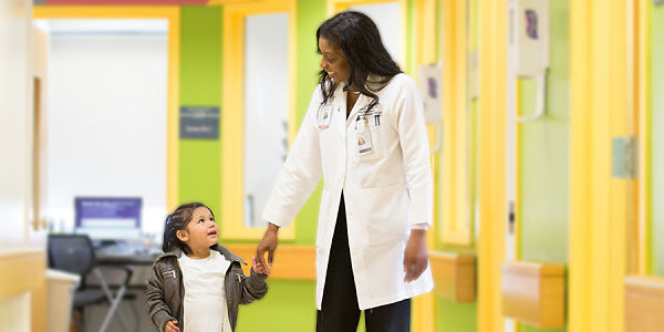 Doctor helps young child